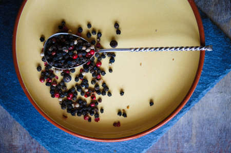 An assortment of different types of pepper grainの写真素材
