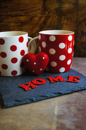 Red tea cup with tea and lemon on the old wooden background with noteの写真素材