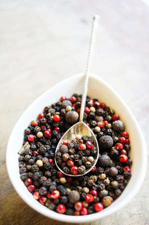 An assortment of different types of pepper grainの写真素材