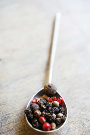 An assortment of different types of pepper grainの写真素材