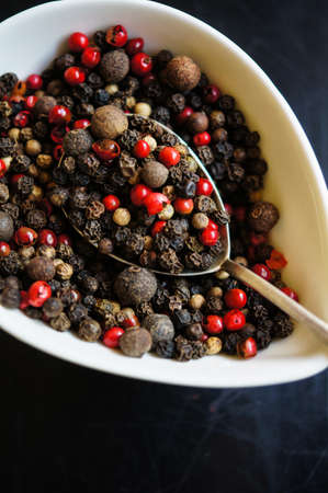 An assortment of different types of pepper grainの写真素材