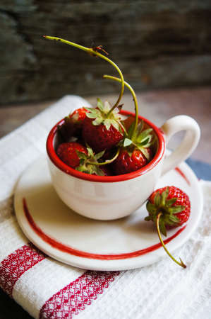 Fresh strawberries on the old wooden backgroundの写真素材