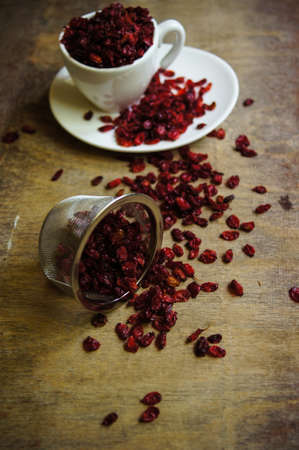 dried goji berries on the rustic style old table
