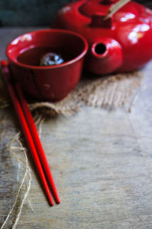 Green Tea Set, chopsticks, tea pot and cups on rustic wooden tableの写真素材
