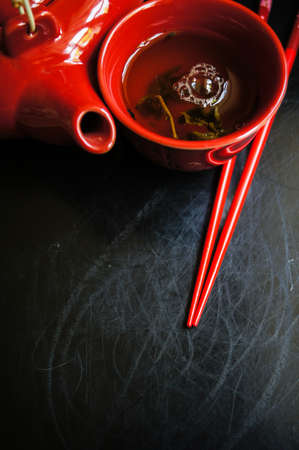 Green Tea Set, chopsticks, tea pot and cups on rustic wooden tableの写真素材