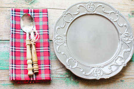 Table Setting with napkin and silverware on wooden tableの写真素材