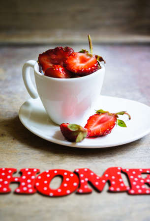 Fresh strawberries in the glasses as a dessert on rustic style tableの写真素材