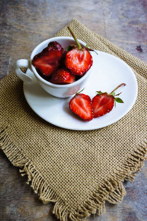 Fresh strawberries in the glasses as a dessert on rustic style tableの写真素材