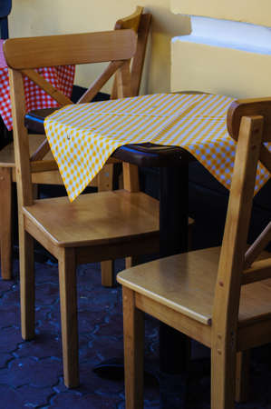 Outdoor cafe's tables and chairs with flowers in Kiev downtown