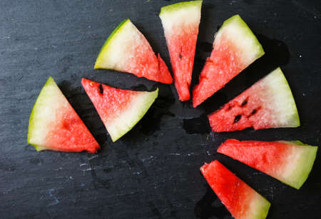 watermelon popsicle yummy fresh summer fruit sweet dessert on vintage old wood teakの写真素材