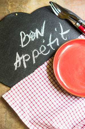 Table Setting with napkin and silverware on wooden tableの写真素材