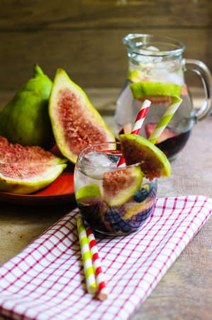Cold lemonade with figs, blueberry, and plumsの写真素材