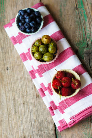 Summer berries, blueberries and raspberries, selective focusの写真素材