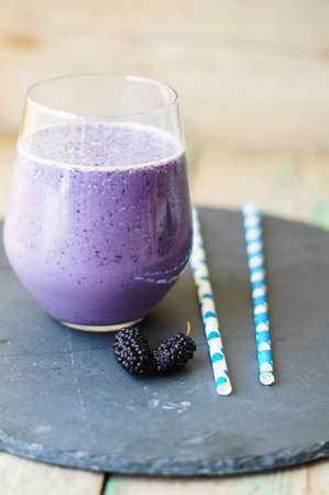 Healthy breakfast with glass of mulberry smoothieの写真素材