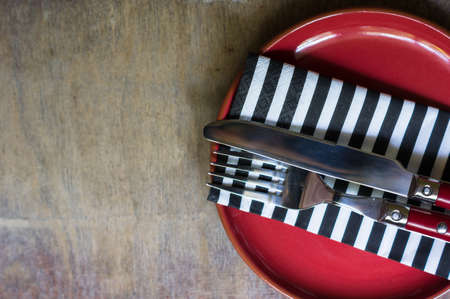 Table Setting with napkin and silverware on wooden tableの写真素材