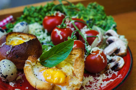 Healthy Egg in a Basket with fresh vegetable salad for dinner
