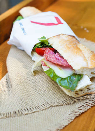 Sandwiches with  salami for lunch outdoorの写真素材