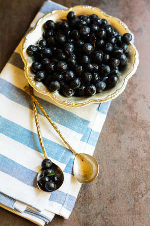 Fresh blueberries in the vintage style bowlsの写真素材