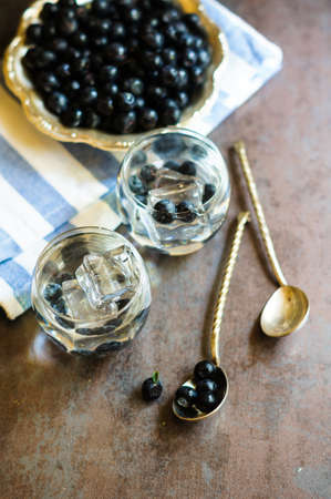Detox water cocktail,blueberry ,lime, lemon and ice.selective focus