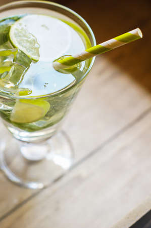 Glass with homemade lemonade with lime and mintの写真素材