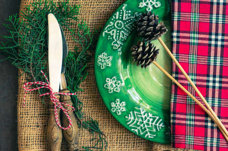Vintage or rustic christmas table setting. Toned image