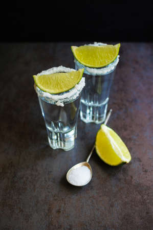 Tequila shot with lime . Selective focus