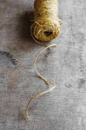 Christmas wrapping accessories on old wooden background. Selective focusの写真素材