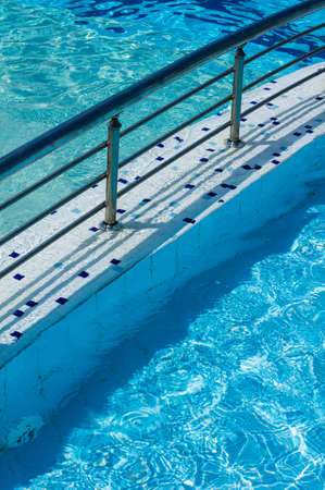 Blue swimming pool rippled water detailの写真素材