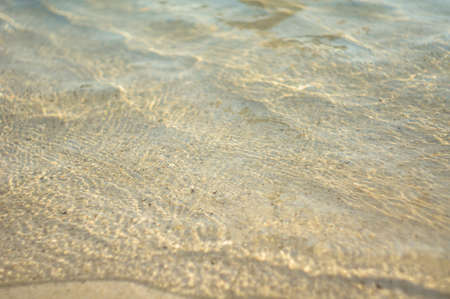 Yellow sand beach and sea wavesの写真素材