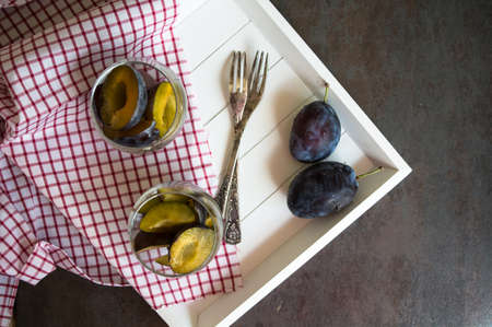 Sweet plum dessert with cinnamon in vintage styleの写真素材