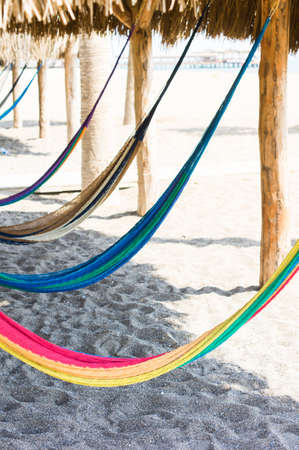 Travel concept with a hammock in a tropical beachの写真素材