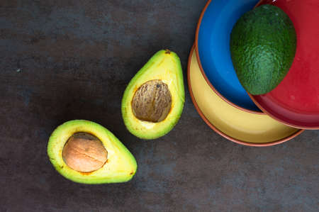avocado on a dark wood background. tinting. selective focus
