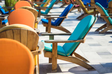 Wooden sun chair on outdoor deck cafe overlooking the Mediterranean Seaの写真素材