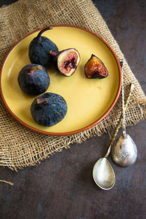 Ripe fig fruits on the dark vintage background. Selective focusの写真素材