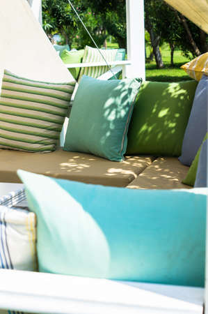 Wooden sun chair on outdoor deck cafe overlooking the Mediterranean Sea