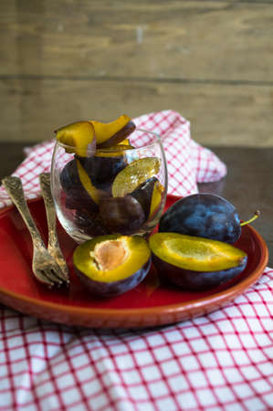 Sweet plum dessert with cinnamon in vintage styleの写真素材