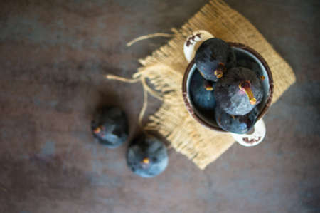 Ripe fig fruits on the dark vintage background. Selective focusの写真素材