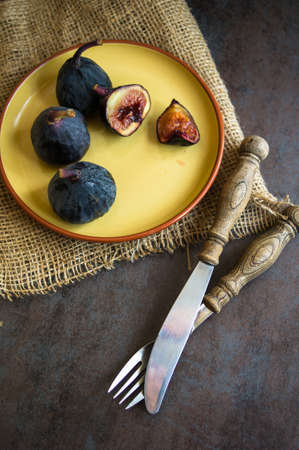 Ripe fig fruits on the dark vintage background. Selective focusの写真素材