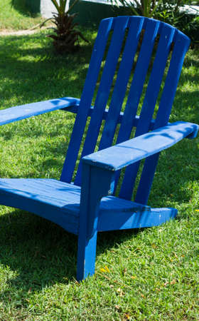 Bright color wooden sun chairs in the beach gardenの写真素材