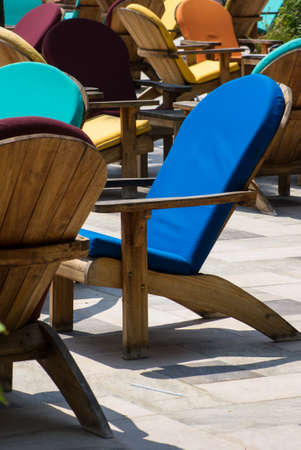 Wooden sun chair on outdoor deck cafe overlooking the Mediterranean Seaの写真素材