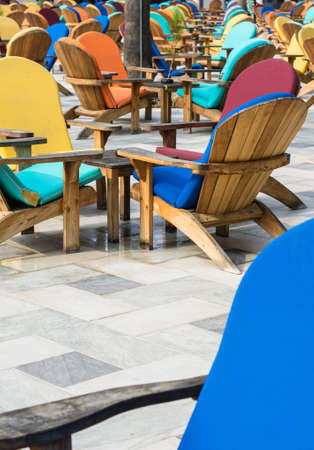 Wooden sun chair on outdoor deck cafe overlooking the Mediterranean Seaの写真素材