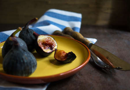Ripe fig fruits on the dark vintage background. Selective focusの写真素材