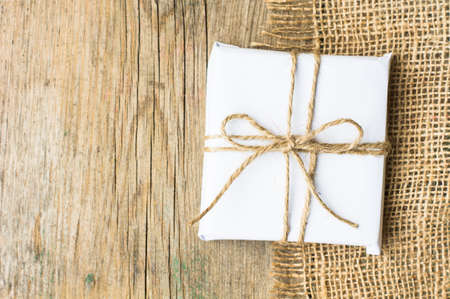Christmas presents in rustic style with holiday decorations, selective focus