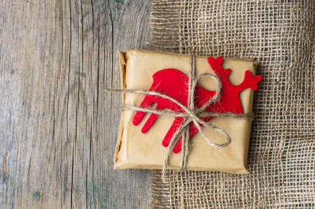 Christmas presents in rustic style with holiday decorations, selective focus