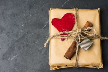 Presents withred heart on wooden board for valentines day