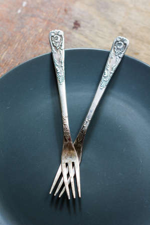 Table setting for Christmas eve with sweets and fir tree branchの写真素材