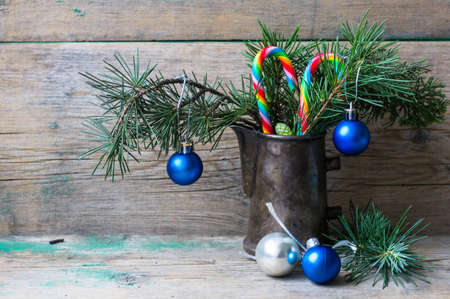 Winter branches with Christmas decoration tree in vintage  jug