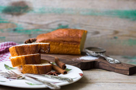 Christmas cake with anise star and cinnamon on the  christmas decorated plateの写真素材
