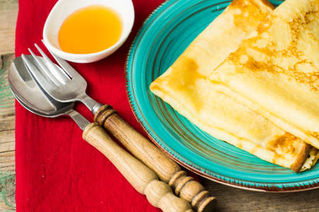 Dessert with pancakes and honey, vintage and rustic backgroundの写真素材