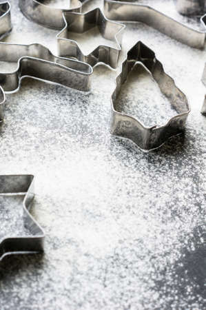 Holiday Cookie Cutters on Rustic black stone backgroundの写真素材